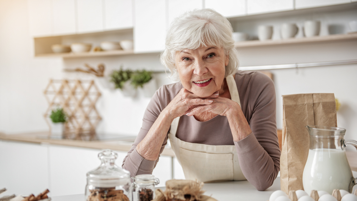 Grandmother making natural remedies in her kitchen