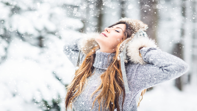 Woman enjoying the forest in winter